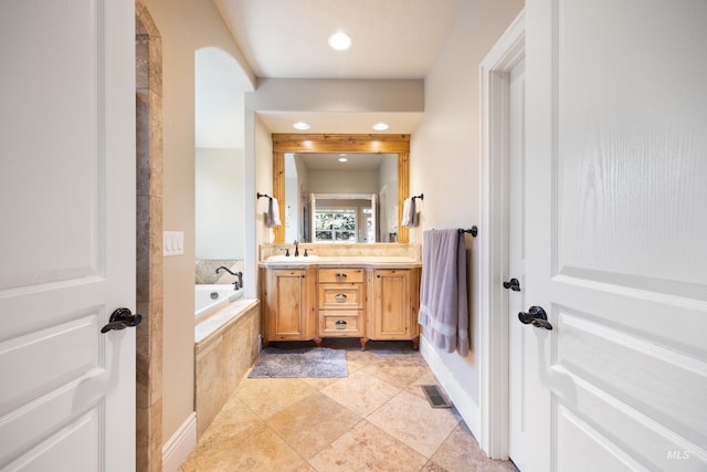 1664 W Par Ct, Eagle, ID 83616 - bathroom featuring double vanity, a garden tub, tile patterned floors, and recessed lighting