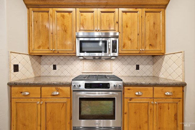 1664 W Par Ct, Eagle, ID 83616 - kitchen featuring appliances with stainless steel finishes, tasteful backsplash, and dark countertops
