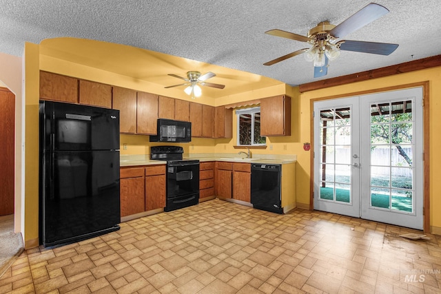 kitchen featuring ceiling fan, a textured ceiling, french doors, and black appliances