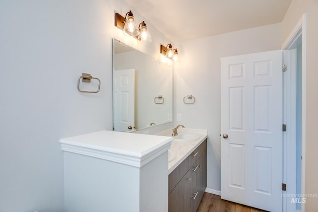 bathroom with wood-type flooring and vanity