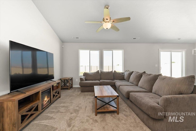 living room with light carpet and ceiling fan