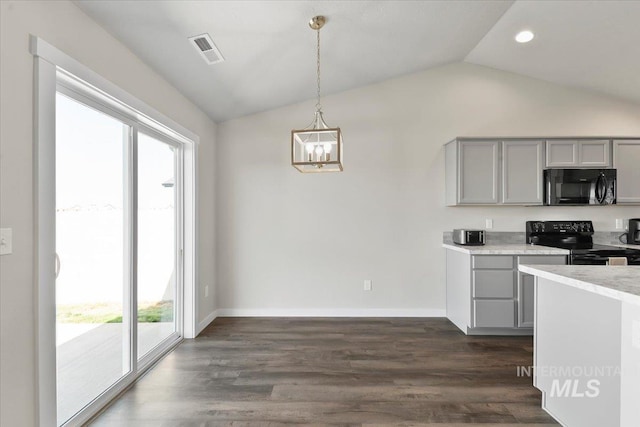 kitchen featuring gray cabinetry, dark wood-type flooring, pendant lighting, lofted ceiling, and black appliances