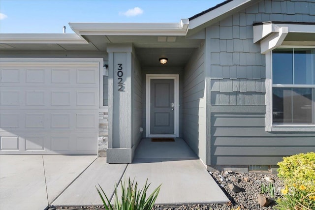 doorway to property featuring a garage