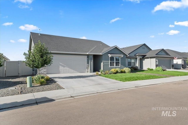 single story home featuring a front lawn and a garage