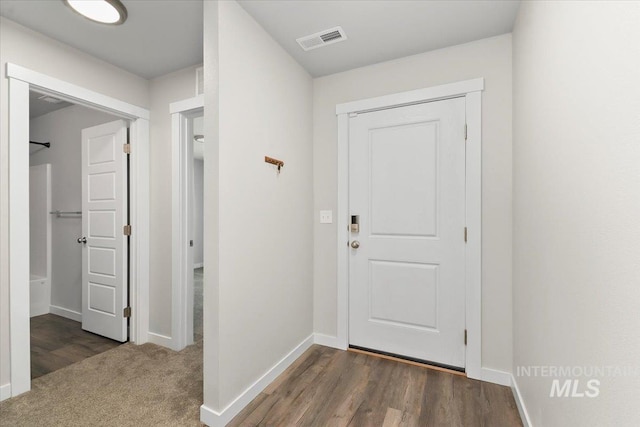 doorway to outside featuring dark hardwood / wood-style floors