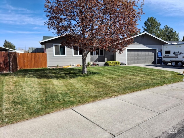 ranch-style house featuring concrete driveway, a garage, and covered porch