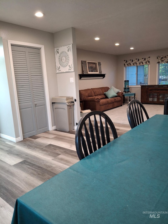 dining area with light wood finished floors, recessed lighting, and baseboards