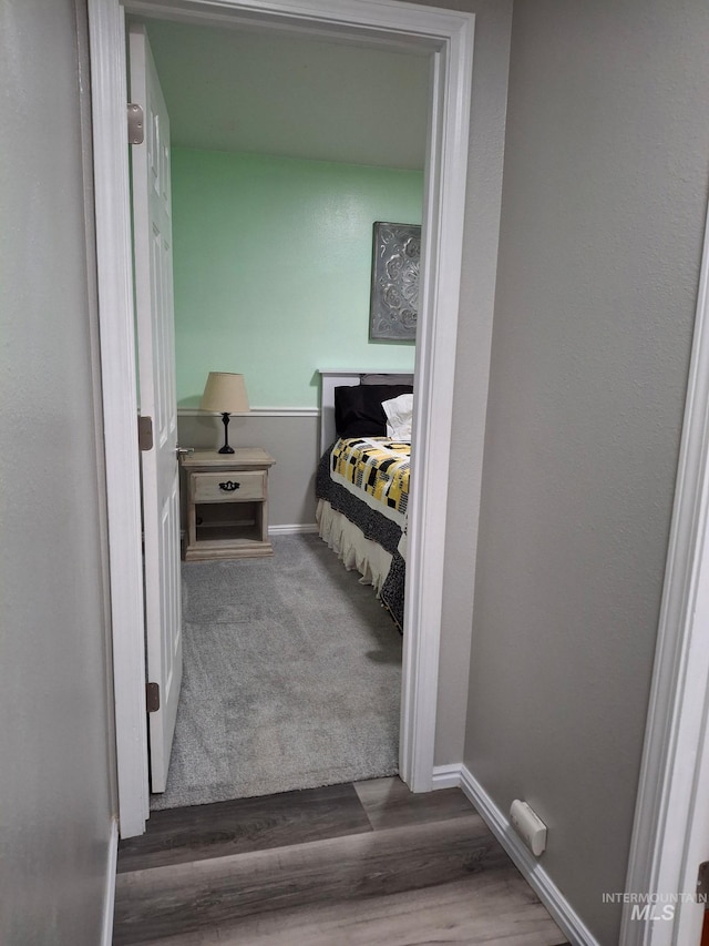 bathroom featuring wood finished floors and baseboards