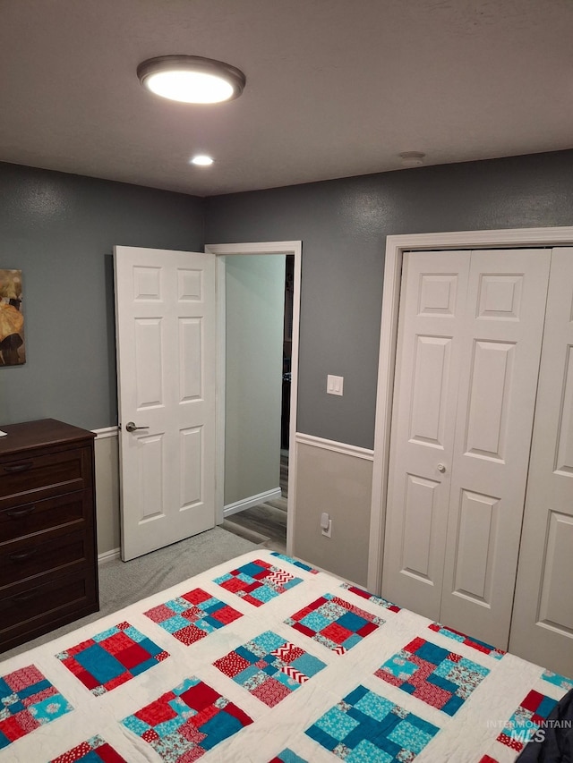 bedroom featuring a closet and carpet