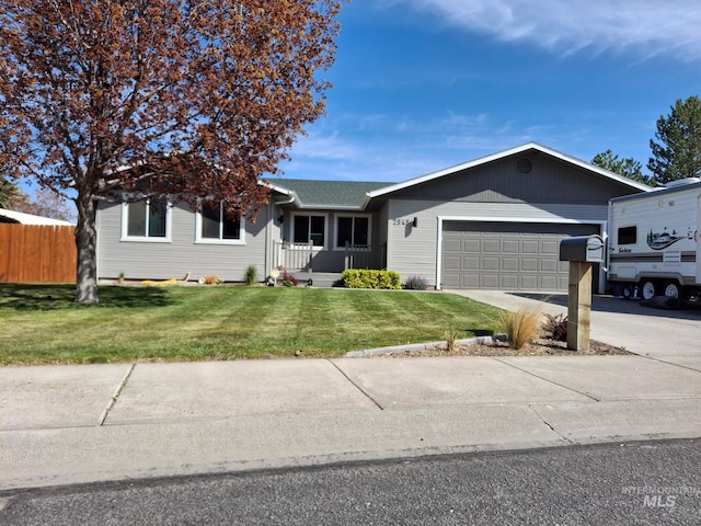 single story home with a garage and concrete driveway