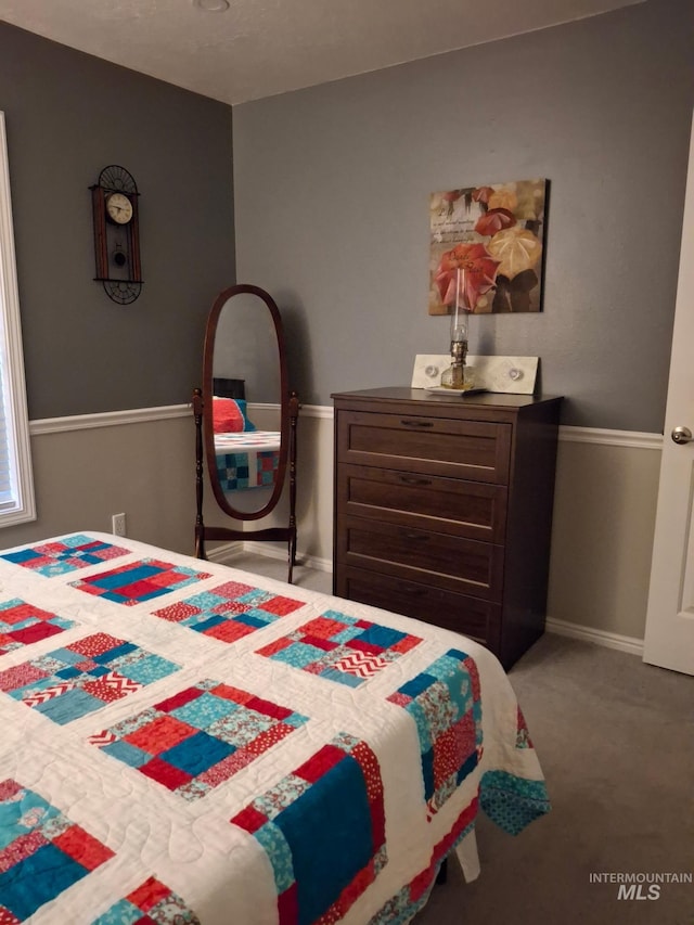 bedroom with carpet flooring and baseboards