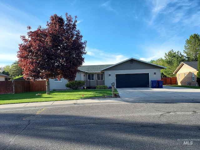 ranch-style house with an attached garage and driveway