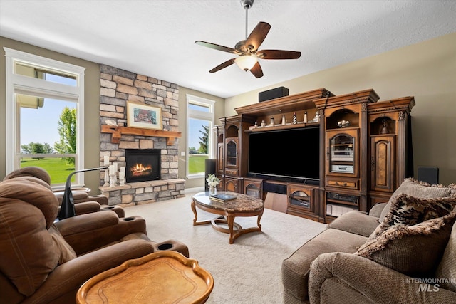 8585 W Rioja St, Star, ID 83669 - living area featuring a fireplace, carpet, and ceiling fan