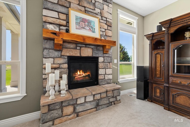 8585 W Rioja St, Star, ID 83669 - living area featuring baseboards, carpet, and a fireplace