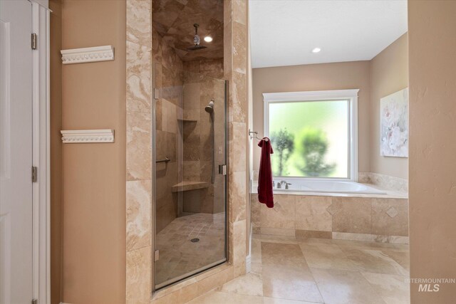 8585 W Rioja St, Star, ID 83669 - bathroom with a stall shower, a garden tub, and recessed lighting