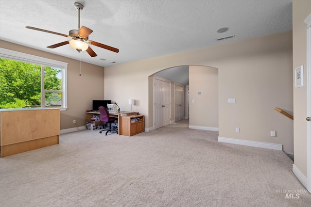 8585 W Rioja St, Star, ID 83669 - carpeted office with arched walkways, ceiling fan, a textured ceiling, and baseboards