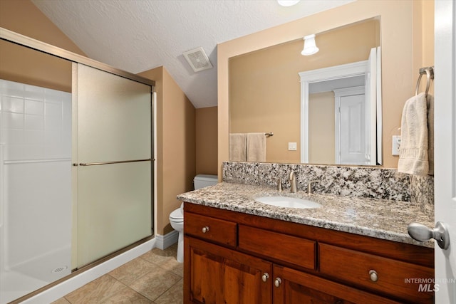 8585 W Rioja St, Star, ID 83669 - full bath featuring toilet, vanity, a shower stall, lofted ceiling, and tile patterned floors