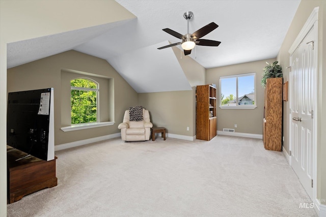 8585 W Rioja St, Star, ID 83669 - unfurnished room with healthy amount of natural light, light carpet, vaulted ceiling, a ceiling fan, and baseboards