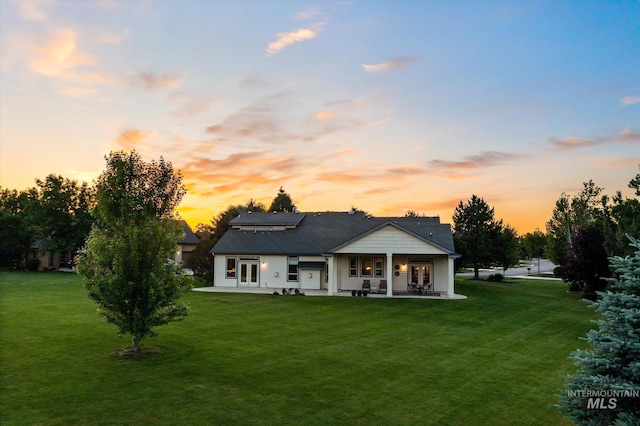 8585 W Rioja St, Star, ID 83669 - back of property featuring french doors, a yard, and a patio