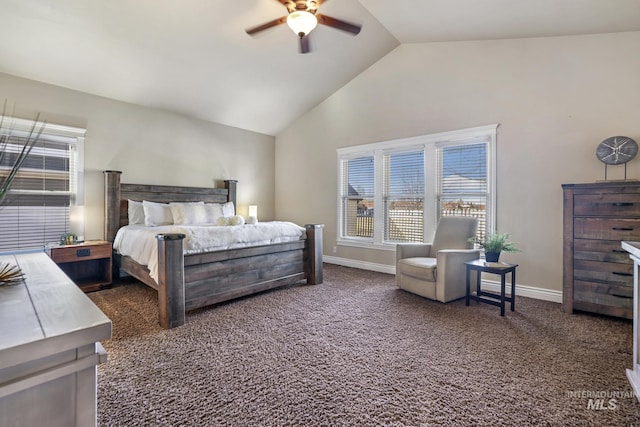 bedroom with lofted ceiling, ceiling fan, and dark carpet