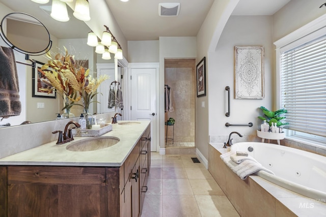 bathroom with separate shower and tub, tile patterned flooring, and vanity