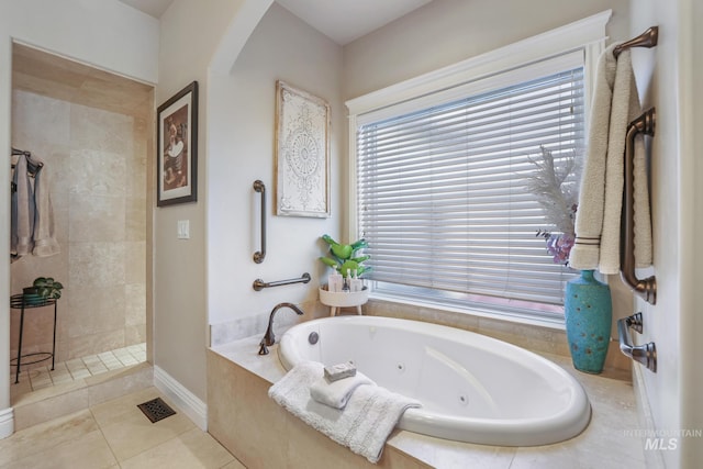 bathroom featuring tile patterned flooring and plus walk in shower