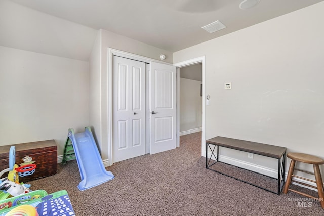 game room featuring dark colored carpet