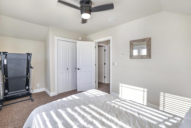 carpeted bedroom with lofted ceiling, a closet, and ceiling fan