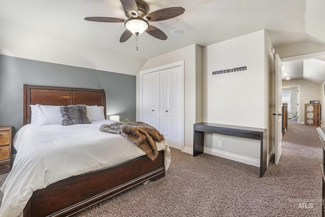 bedroom with ceiling fan, a closet, vaulted ceiling, and dark carpet