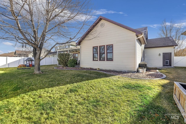 view of home's exterior with a lawn