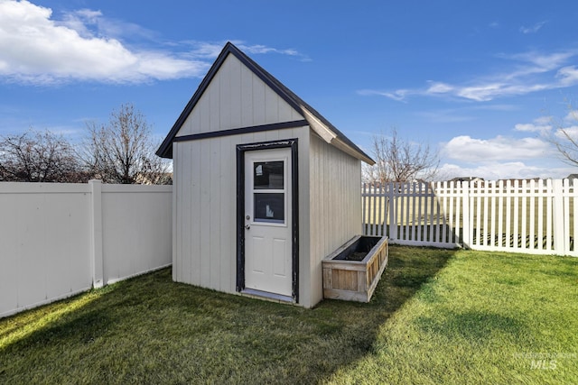 view of outbuilding featuring a yard