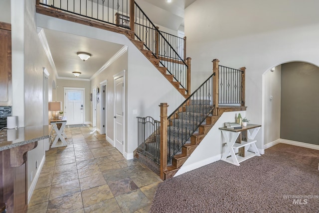 foyer entrance featuring ornamental molding