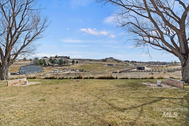 view of yard with a rural view