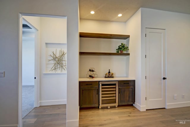 5728 S Keyport Way, Meridian, ID 83642 - indoor dry bar featuring wine cooler, light wood-style floors, recessed lighting, and baseboards