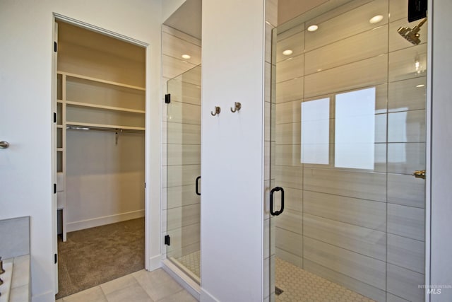 5728 S Keyport Way, Meridian, ID 83642 - full bathroom featuring a spacious closet, a shower stall, tile patterned flooring, and baseboards