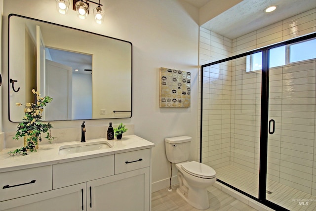 5728 S Keyport Way, Meridian, ID 83642 - bathroom with vanity, toilet, a stall shower, baseboards, and recessed lighting