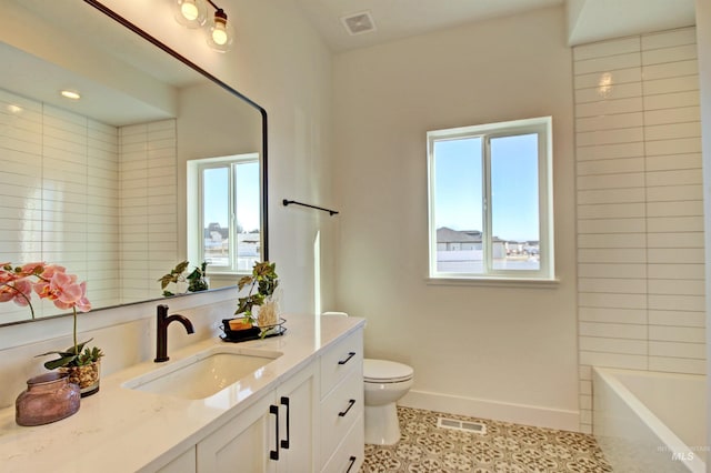 5728 S Keyport Way, Meridian, ID 83642 - bathroom featuring vanity, healthy amount of natural light, toilet, and baseboards