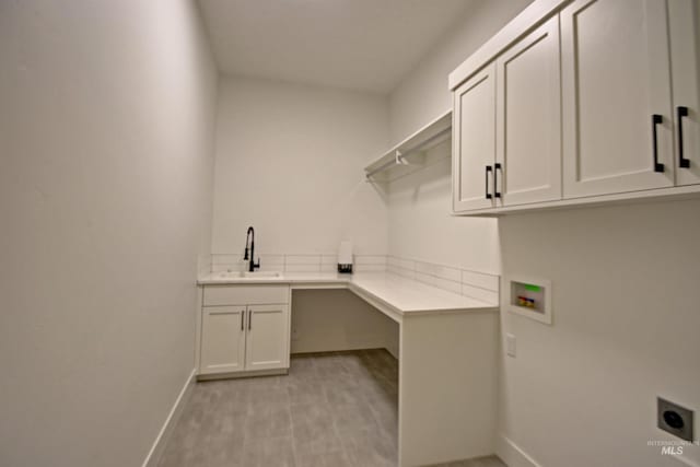 5728 S Keyport Way, Meridian, ID 83642 - laundry area featuring cabinet space, electric dryer hookup, baseboards, and hookup for a washing machine