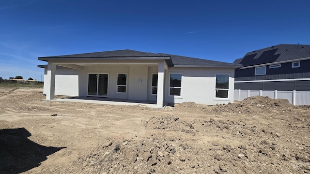 5728 S Keyport Way, Meridian, ID 83642 - back of house featuring a patio, stucco siding, and roof with shingles