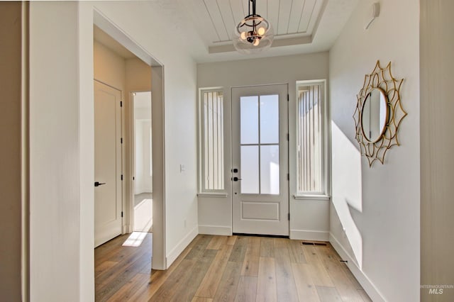 5728 S Keyport Way, Meridian, ID 83642 - foyer featuring healthy amount of natural light, light wood-style flooring, and baseboards