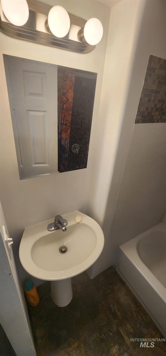 159 Chief Looking Glass Ln, Kamiah, ID 83536 - full bathroom with a tub and a sink