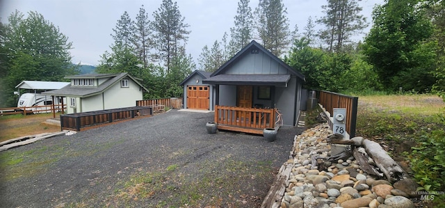 159 Chief Looking Glass Ln, Kamiah, ID 83536 - view of front of property featuring board and batten siding, fence, and driveway