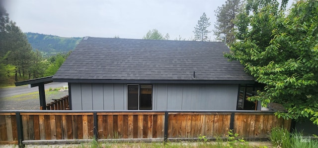 159 Chief Looking Glass Ln, Kamiah, ID 83536 - rear view of house featuring a shingled roof and fence