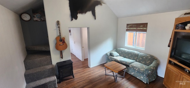159 Chief Looking Glass Ln, Kamiah, ID 83536 - sitting room with lofted ceiling, dark wood-style flooring, a wood stove, and baseboards