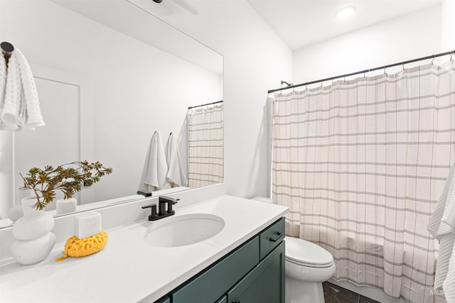 357 E Lombard Ln The Dayton, Unit The Dayton, Eagle, ID 83616 - bathroom featuring toilet, vanity, shower / tub combo with curtain, and recessed lighting