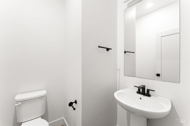 357 E Lombard Ln The Dayton, Unit The Dayton, Eagle, ID 83616 - bathroom with a sink, toilet, and baseboards