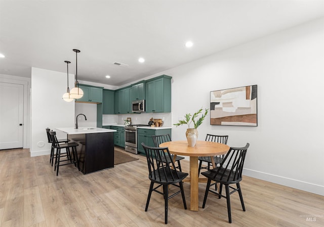 357 E Lombard Ln The Dayton, Unit The Dayton, Eagle, ID 83616 - dining room with baseboards, light wood-style floors, and recessed lighting