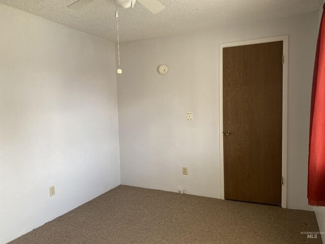 1472 En Casa Villa Dr, Mountain Home, ID 83647 - carpeted spare room with a ceiling fan and a textured ceiling