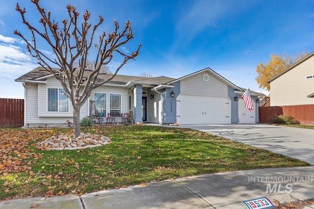 ranch-style house with a front yard and a garage