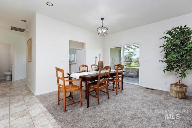 dining room with a chandelier